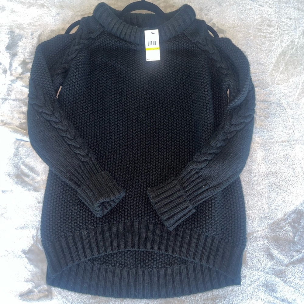 Black chunky sweater with shoulder cut outs in size M. Never been worn